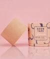 Boob tape with packaging on a pink background