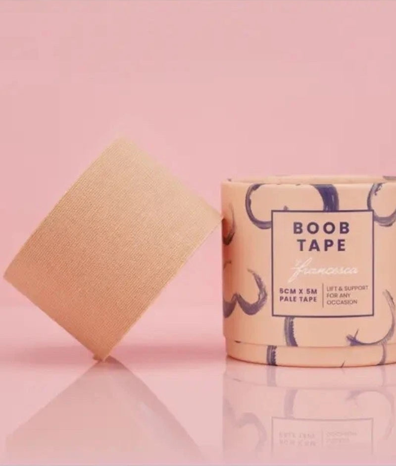 Boob tape with packaging on a pink background