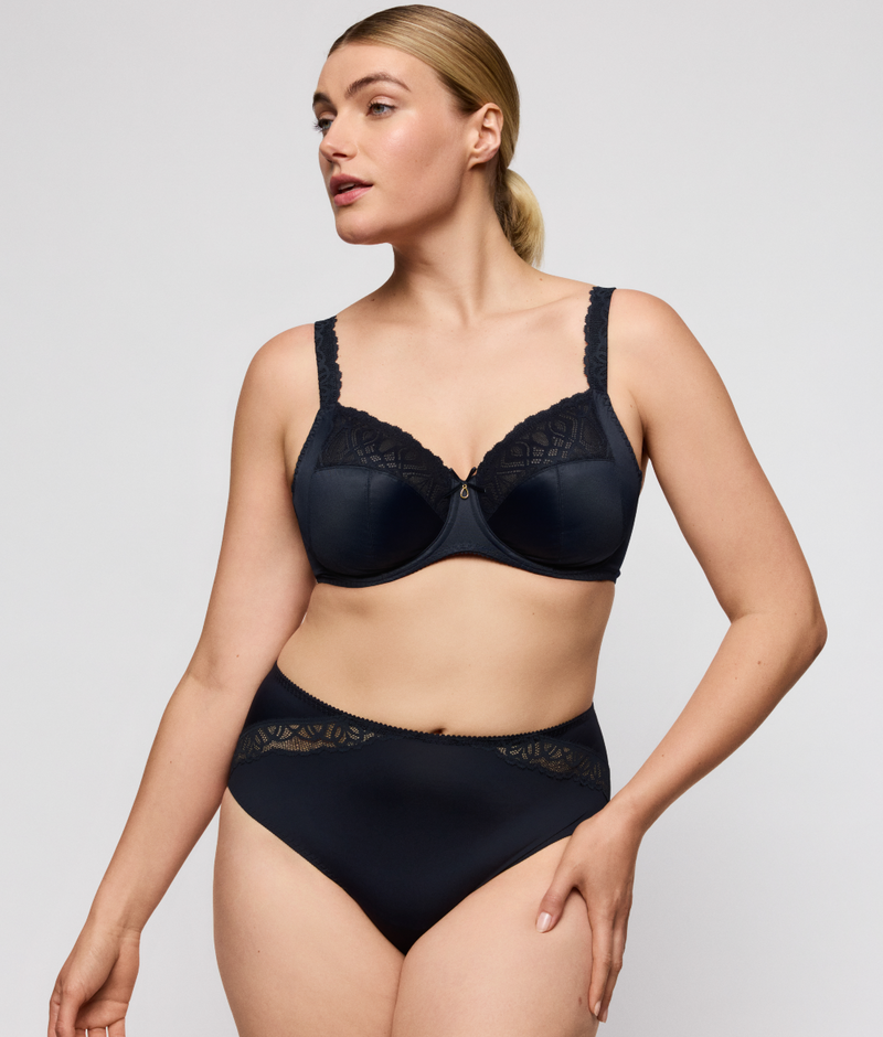 Woman wearing Primadonna Salerno Full Brief and Bra in Midnight Blue, set on a plain background