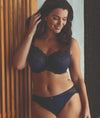 Model wearing Fantasie Reflect Underwired Bra and Brief set in Navy with 