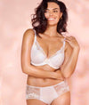 Model wearing Wacoal Most Divine Underwired Plunge Bra & short set in White